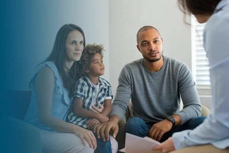 couple talking to family counselor blue