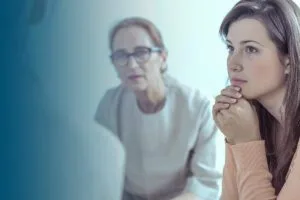woman and therapist during meeting of support