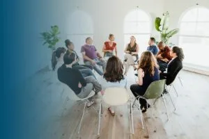 diverse people in a supporting group session