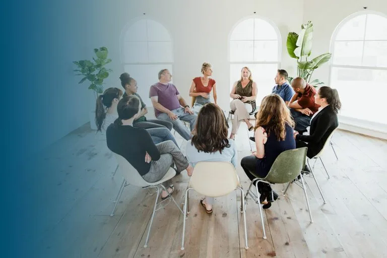 diverse people in a supporting group session